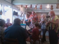 IMAG0722  The start of our Saturday morning - Farmer's Market then down to Lynnwood where Sam joined an ukulele jam session. Such nice people! Sam is still pretty shy about performing - he really doesn't want to mess anyone up. But I try to gently encourage him to play with other people as often as possible, which isn't all that often here. But this group meets on the weekends.