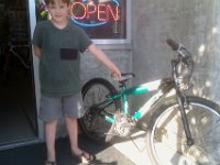IMAG0766  Then to pick up Ben's pick from tuning up...Sam likes this 24" bike. Used at $179. Yikes.