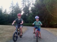 IMAG0768  Ben was frustrated at first, lots of growling (gravel makes it tricky - the training wheels prop the tire off the ground at times). Then the second lap was much better - we "got back on the horse" and went at it again. Sam was a generous soul to let Ben bike alongside him. I could see how proud Ben was of himself.