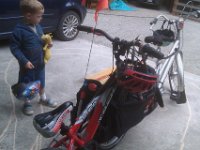 IMAG0797  Sam had this great idea that I bring a bike to school for him to ride by hitching it to the cargo bike and towing it. So I did, with his new bike! What a great surprised look he had when I rolled up, as requested, with a NEW BIKE! With gears!