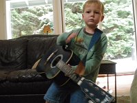IMGP4859  Not to be outdone...but down to three strings. I let him work his way down the strings 'til there's just one for a while, then we restring. Otherwise it's really loud around here.