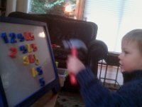 IMAG1049  Preschool for Ben. He loves noise and action, so we pound letters and numbers. Hey - I do what I can with the guy. He is a hard one to educate! He plays dumb because it's funny. Then he comes out with stuff that tells you his brain is alive and well in there.