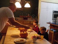 IMGP5250  Daddy serving up farm breakfast. We have a little routine - the boys and I go out and do the weekly chicken chores (clean water, refill feed, clean coop) while Dave prepares eggs and pancakes for breakfast!