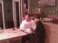 IMAG1232  Showing Dad his first ever paper - topic was The Sun. It is 511 words. He dictated it to me.
