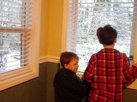 IMGP5791  Sam and Ben peering out from their room on Sunday morning, noticing a BLANKET of snow!