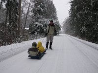 IMGP5900  Out on sleds going down to a neighborhood trail where there will be some hills.