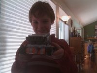 IMAG1775  Mindstorms arrived on Tuesday!!! Sam got the little robot built up right away and is busy learning how to program it using Richard's old Vaio laptop. Glad we still have that to use! Thanks, Richard!