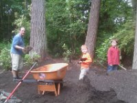 IMAG1799  Shoveling 8 cubic yards of dirt around an area cleared by R&R Landscaping. They did a great job on the clearing and the rock wall you can barely see!