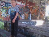 IMAG2166  A really weird place we found out on a hike. Full of glass and hypodermics. Some other families were letting the kids run and jump in here. Made my hair stand on end. Let's get outta here! It's an abandoned lumber mill building.