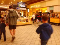 IMG 20121014 161121  The next day, Sunday, exhausted, we were out on very random adventures. This is us in the mall. We NEVER go to the mall. I found it so humorous and other-wordly that I was just cracking up. I was overtired, too. But still - who ever heard of a train in the mall, run by a real-live driver in the front? I mean, he could just opt to bounce down the stairs instead of the ramp if he wanted! And I was tempted to just jump on the back like the great train robberies...Bad Mommy!