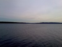 Pic-01012013-001  Now to Port Townsend on a sunny day - we never realized that we could see Mt. Baker, Mt. Rainier and the Olympics all from this pier. Unreal. Sorry you totally can't see but in the middle of this frame and just a hair to the right is Mt Rainier. It is rising from the horizon between the two land masses.