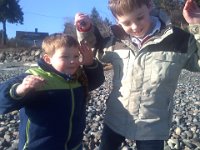 Pic-01032013-006  The crab boys - they each have one in hand and are holding up their "claws" like the crabs. Sam loves to find whole "families" and relocate them to "apartments" complete with living rooms and kitchens. Sometimes even a school. When the doors open for recess (i.e., he lifts the rock up) those crabs scatter like kids in a schoolyard!