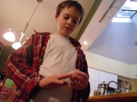 IMGP0271  Sam trying out a glass slide for his guitar - neat!