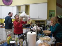IMGP0123  Mom preparing the stuffing. It is now Thursday morning :) I have gone to a Turkey Trot with some friends - I ran up to their house via some trails then Dave picked me up. He played ukulele with Christine's Dad (Tom - from Long Island as well!) and then we high-tailed it home to rescue the boiling potatoes.
