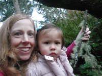 IMGP0132  Taking Isabella out on a hike in our woods for a little bit while Mary relaxed. She walked all the way out to the boys' fort, learning to watch out for slippery roots! We also talked about "windy, windy!" and moss and lichen.