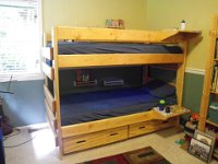 IMGP9941  The finished beds with nice shelves installed by Daddy on the walls. They are spice racks and do a good job of holding books and reading lights.