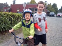 Pic-09142013-001  Out on a bike/run with my boys. Sam found some nuts and washers on the side of the road, so of course we ran home with those in hand. Ben is learning to brake - there are a LOT of hills here. Serious ones. He's on a bigger bike with a hand brake now.