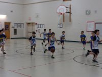 DSC00218  Sam's second basketball game. His team is in white jerseys.