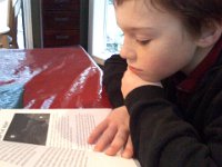 Pic-12252013-002  Sam is studying a Minecraft book :)