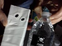 20141031 192026  Joanne always makes awesome drinks! These are mummy juice boxes and poison water!