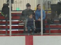 DSC01741  Now we're at Sam's first hockey game. Ben is in the bleachers watching while I am getting trained on all the stuff behind the bench.