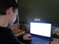 20150111 115149  Sam at work. I'm going to try to get his computer programming software onto the big computer as well. He needs a bigger screen.