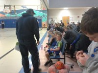 20150117 143105  Looking at Mommy during the compliment - he is so cute! He will look over to me during helpful criticism (coaching) and compliments to see my reaction :) You can see big brother here as well - Sam carefully watches the game and calls every foul.