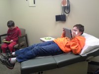 20150220 155221  Once again in the doctor's office. Trying to keep them from touching each other, me, or anything in the exam room. So - first time I've let them bring devices to the doctor.