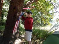 DSC02069  Dad hanging our camping flag. We have inherited it - thank you so much! It is an honor to fly your flag!