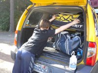 20150610 160715  Sam stuffing hockey gear in the truck. We're picking up two other boys, too.