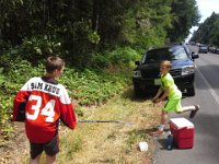 20150627 131035  Fundraising again for Roller Hockey! We hit up the folks walking back from the Rotary Auction, selling cold drinks and watermelon.