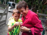 20150710 180212  Gramma and Richard arrived for a few weeks' stay before we go to Orcas Island! Gramma was helping get chickens put away and got herself stuck to the chicken mesh. Ben saved the day!