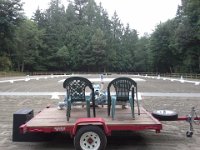20150712 080411  I'm checking out the ride and review set-up on my way to get Emmy ready. I am thinking to myself, there are SO many things she could freak out about. White boxes with flowers, a wagon for a judging platform, and the tents weren't even up yet.