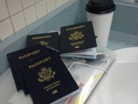 20160808 092531  Many many passports to process! Government and civilian, for all three of us. I need a new purse to hold them all!