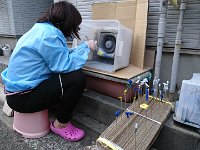 DSC 0370  On a walkabout Yokosuka with the boys we found this lady making plastic models of Gundam. An action figure. How interesting! I wonder if you'll see this on Amazon???