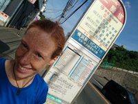 DSC 0533  Here I am dirty, sweaty, thirsty and ready to head home. But buses are inscrutable here. I've worked on unraveling this one stop for 3 weeks now. I know at least 4 buses go back to Yokosuka. I can tell that much from studying routes on the web and making out the kanji on the sign. But WHEN? When do they go? You can look at the row for 1300 (the hour I am studying for transit back home) and you tell me when buses going to Yokosuka stop. Even if you could just tell me buses 6 and 8. When do they stop at this bus stop? I asked a professional man in a suit today and he graciously gave it his best effort, even consulting with a sweet older woman with a purple parasol and matching hair. Still a question mark. Take the next one, he said. But when I questioned the driver: "Sumimasen? Yokosuka?" and got a briskly crossed pair of arms in reply...I just stepped back and laughed literally out loud. It is hysterical. I just run to the bus stop, hope to see a line of people, and wait. Then ask, and when I don't get crossed arms I jump on and watch where it goes! Unlike trains, you can always get off a minute or two later. And I can run for miles...