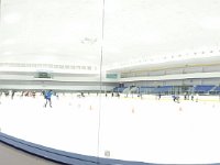 DSC 0602  Open skate - completely dominated by figure skaters. There is a little huddle of hockey players trying to learn to hockey stop down at the end. Ben is in the yellow shirt on the right. He spotted someone in a red helmet and said "Hey! That guy looks SUSPICIOUSLY like Julian!" and ran off to find out. Julian is Ben's good friend from home.