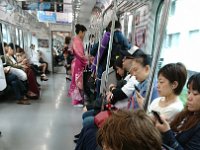 DSC 0608  On the train to Shibuya. Sam looks like a real local now.