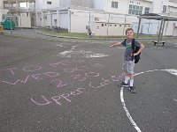 DSC 0745  Ben pointing out our neighbor's brilliant idea to post PTO meeting dates in chalk on all the entrances to school.